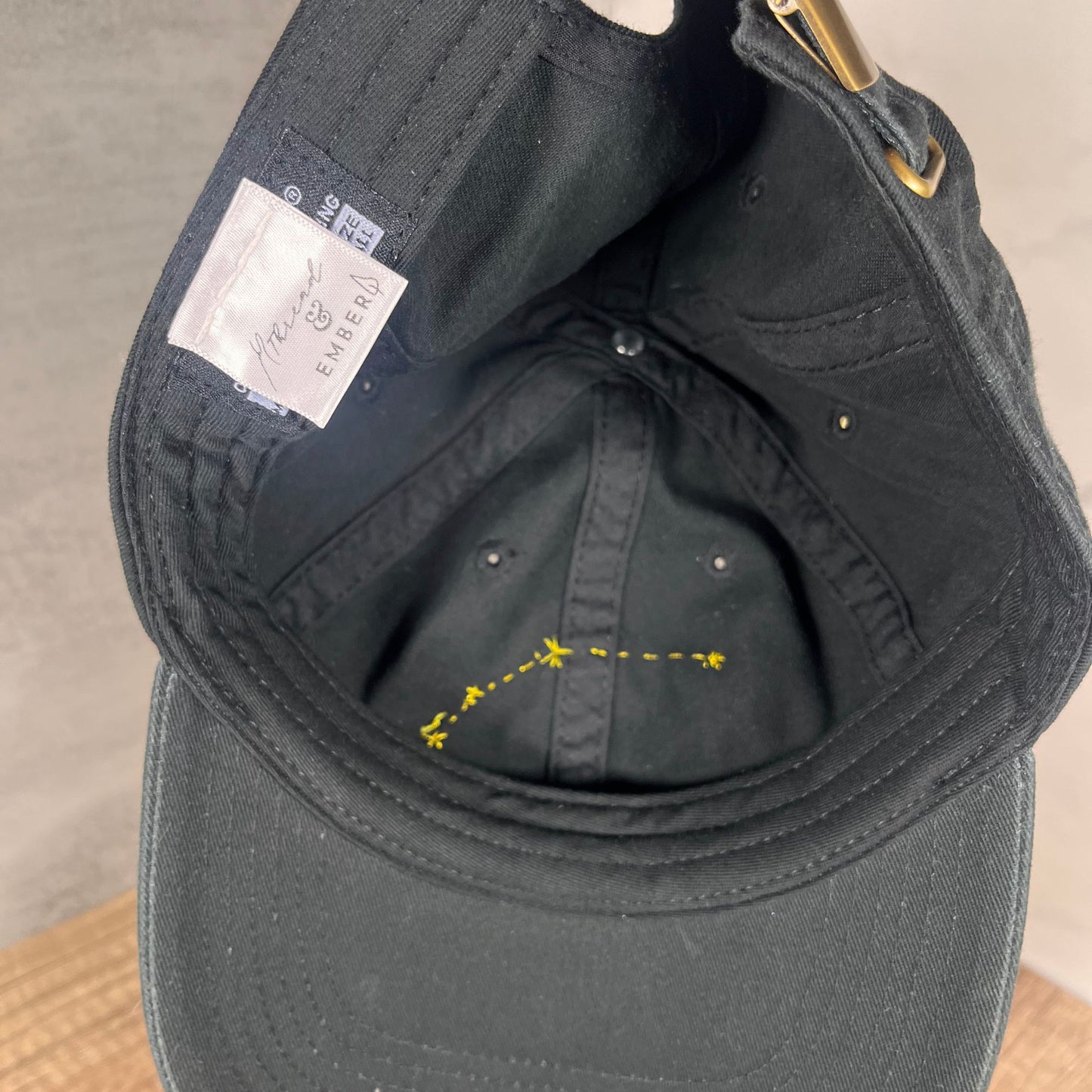 Inside view of the Aries embroidered baseball cap showcasing the detailed embroidery and branded label.