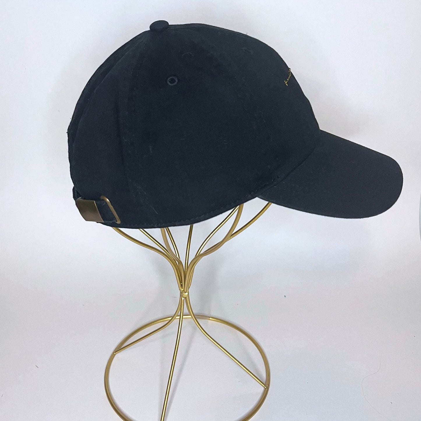 Right side view of the black Aries hand-embroidered baseball cap showing its sleek design and sturdy craftsmanship.