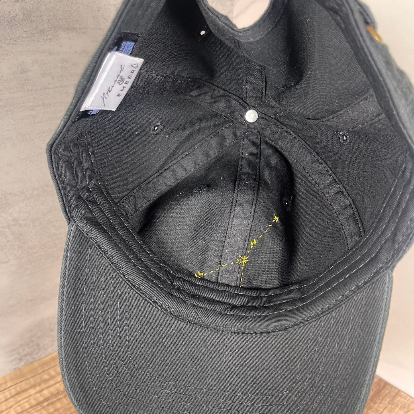 Inside view of the black Cancer hat with constellation embroidery detail
