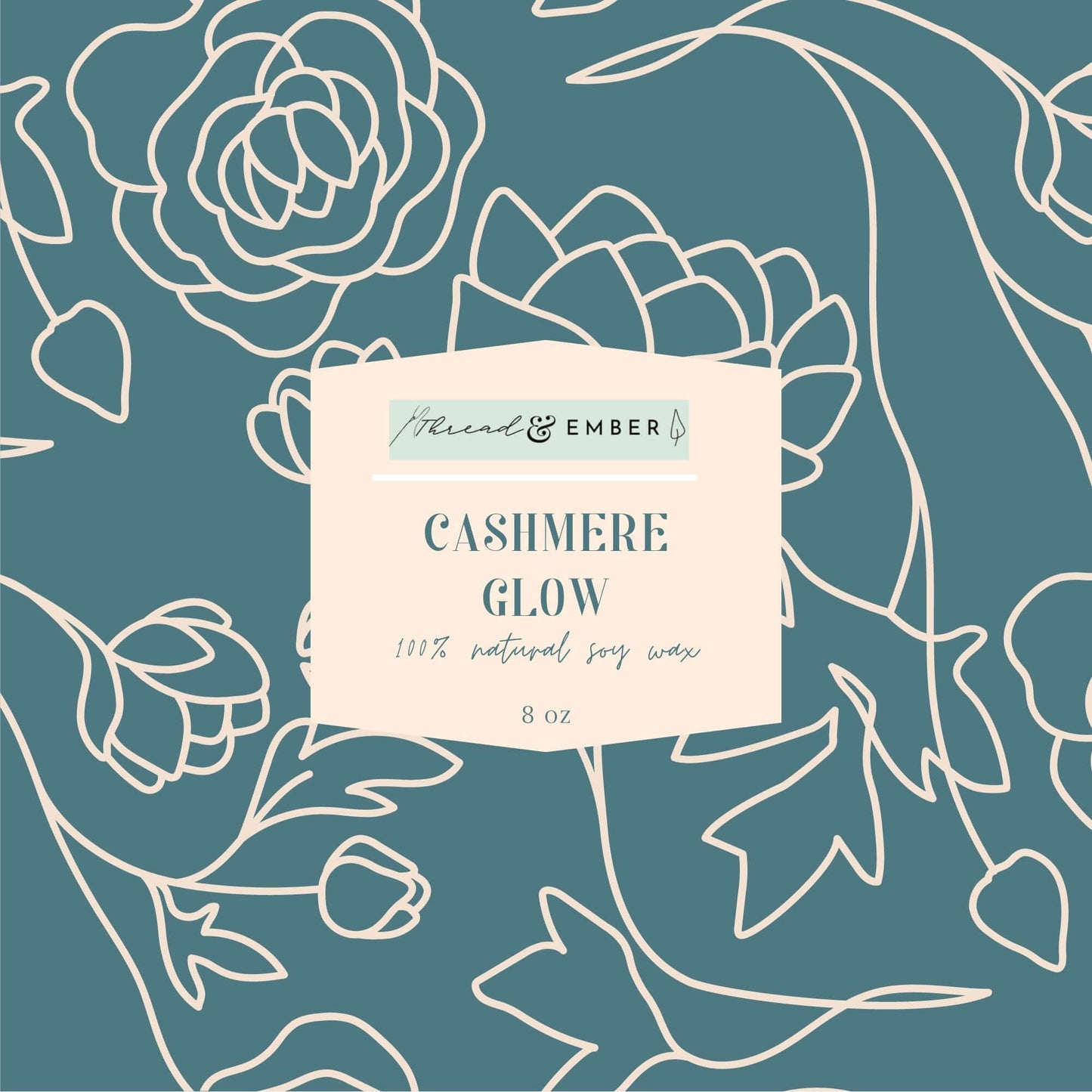 Thread & Ember Cashmere Glow candle label with blue floral background and modern typography.