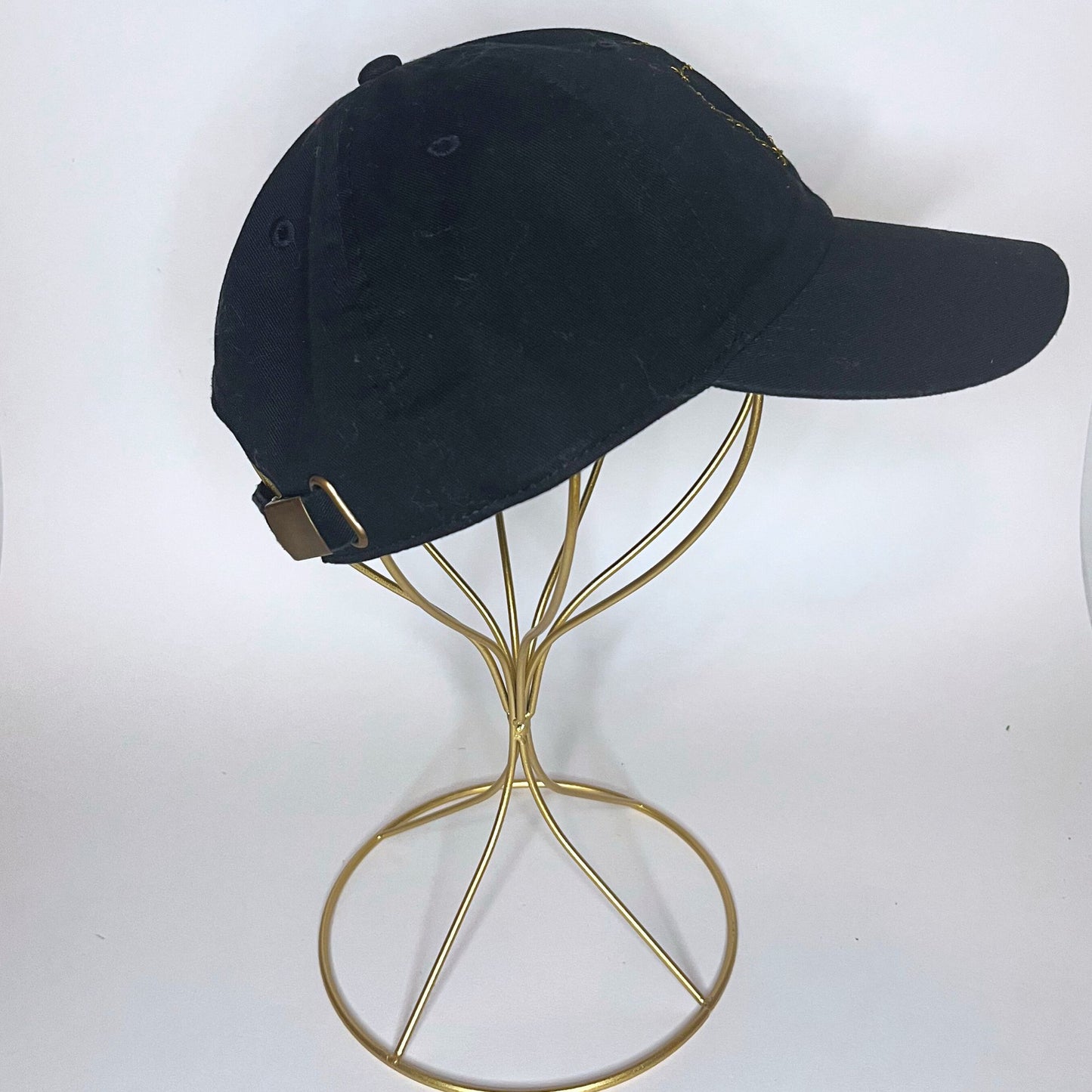 Right-side profile of the black Sagittarius constellation hat, emphasizing its sleek, minimalist design.
