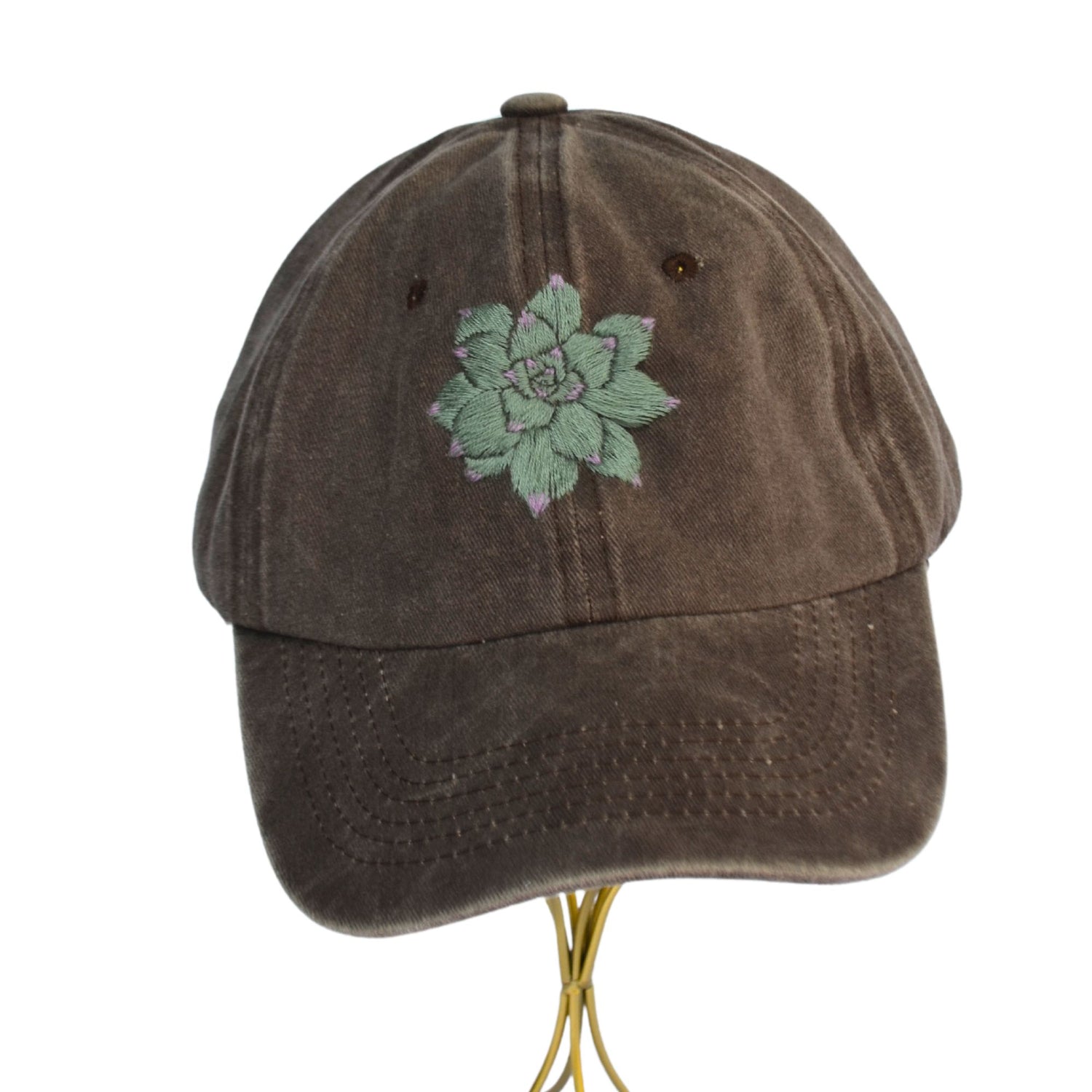 Front view of trendy brown baseball hat with hand-embroidered succulent design.